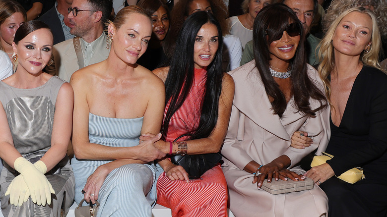 Christina Ricci, Amber Valletta, Demi Moore, Naomi Campbell, and Kate Moss smiling