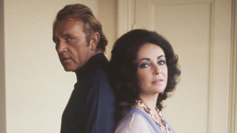 Richard Burton posing with Elizabeth Taylor