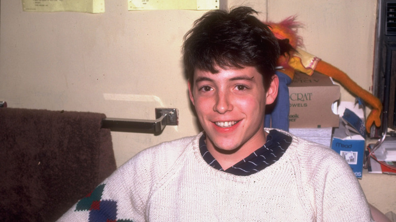 Young Matthew Broderick wearing a white sweater in the '80s.