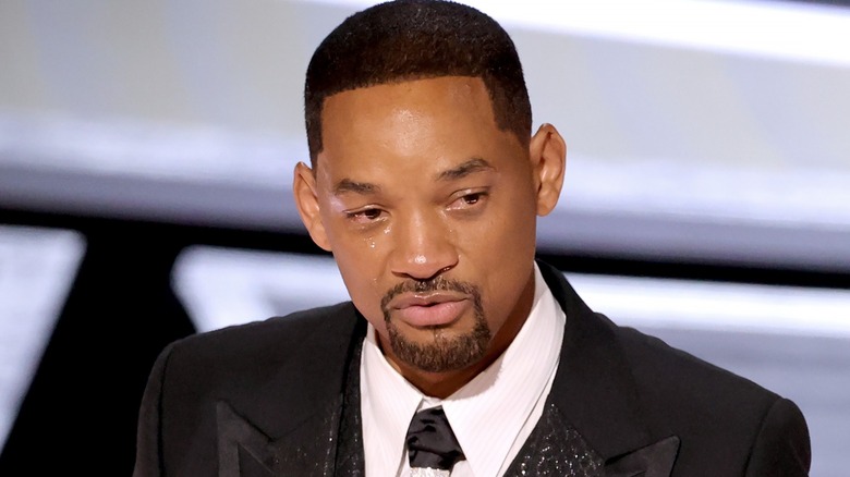 Will Smith cries while on stage at the 2022 Academy Awards