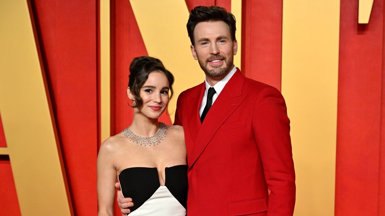 Alba Baptista with Chris Evans posing at the Vanity Fair party