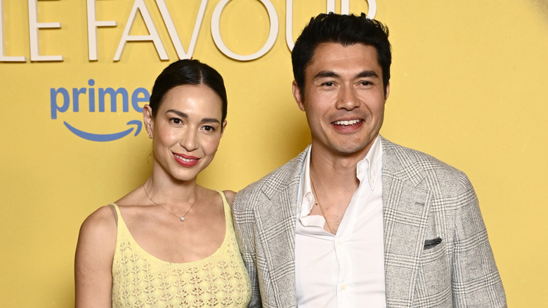 Liv Lo with Henry Golding on a red carpet