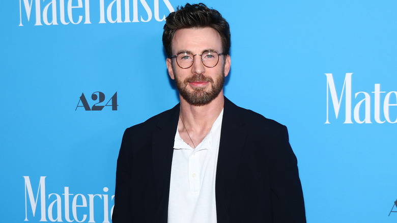 Chris Evans posing at a Materialists event