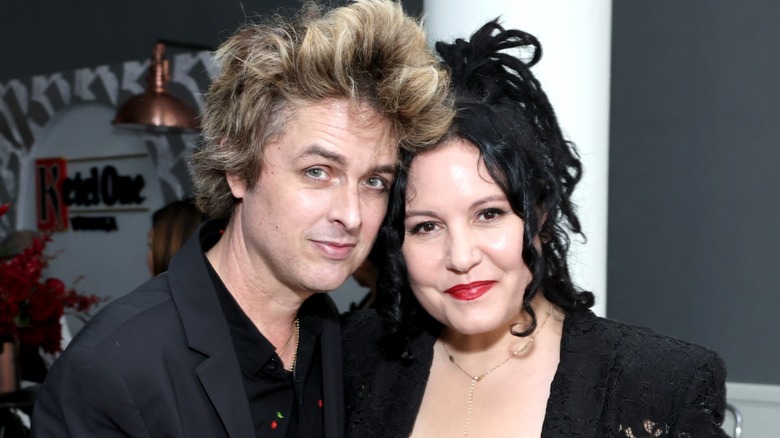 Billie Joe Armstrong and Adrienne Armstrong attending the GLAAD Media Awards wearing black.