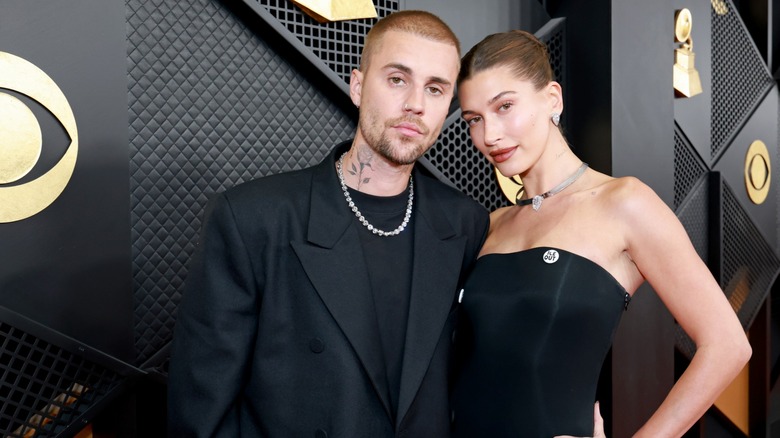 Justin and Hailey Bieber walking the red carpet at the Grammy Awards.