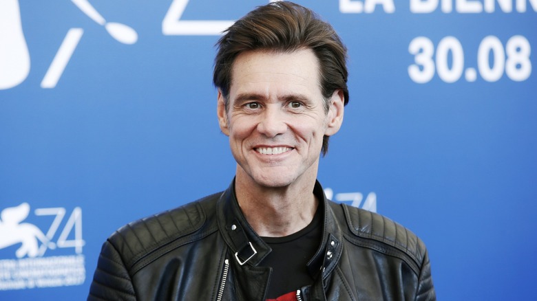 Jim Carrey smiling at the Venice Film Festival.