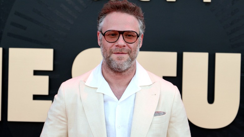 Seth Rogen smiling and wearing tinted glasses at The Studio premiere.