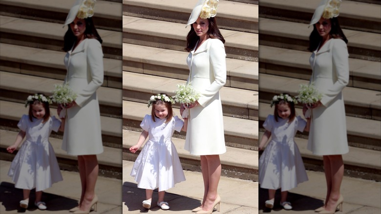 Princess Charlotte holds Kate Middleton's hand