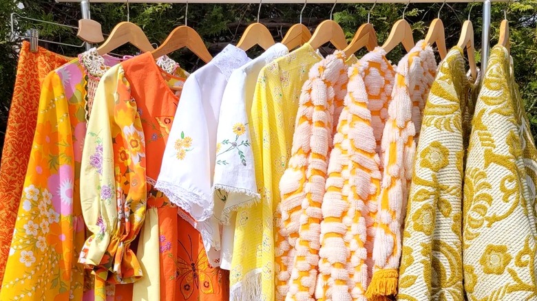 Hangers with yellow and orange clothing