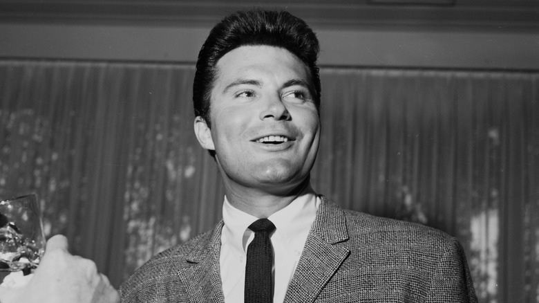 Max Baer Jr. smiling