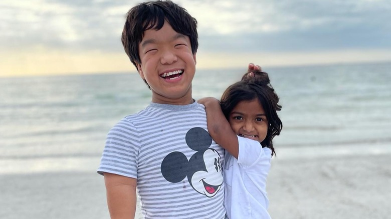 Will and Zoey laughing on the beach