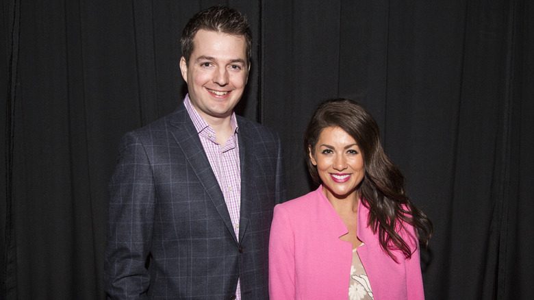 Todd Talbot and Jillian Harris smiling at event