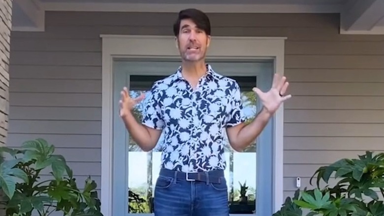 Brian Patrick Flynn presenting in front of home during HGTV "Dream Home" episode