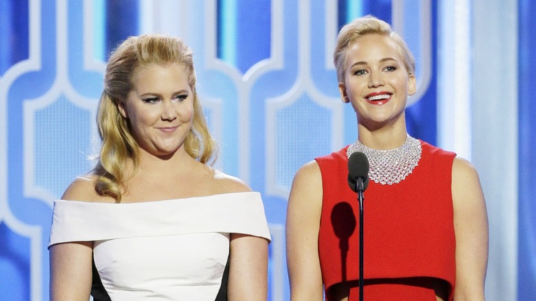 Amy Schumer and Jennifer Lawrence on stage at the 2016 Golden Globes
