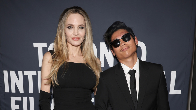 Angelina Jolie and Pax Jolie-Pitt posing at the premiere of "Without Blood" in 2024