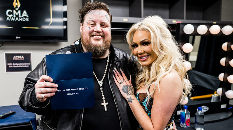 Jelly Roll and Bunnie Xo smiling at the CMA Awards in 2023