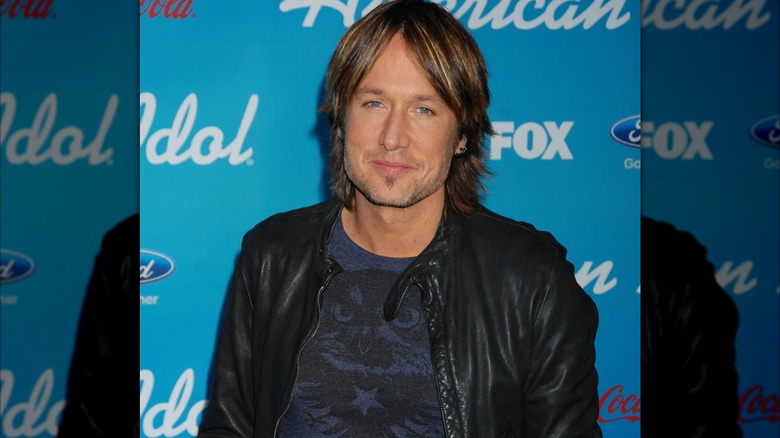 Keith Urban smiling at the season 12 "American Idol" finalist party