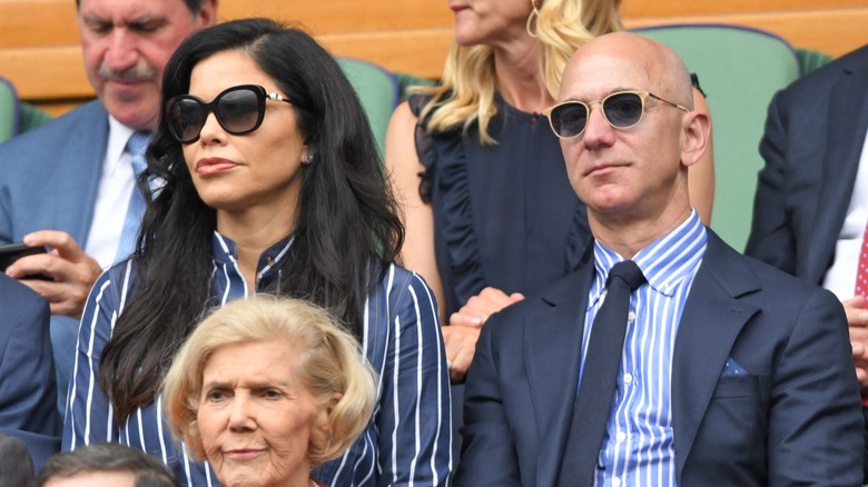 Lauren Sánchez and Jeff Bezos sitting together at the Wimbledon in 2019