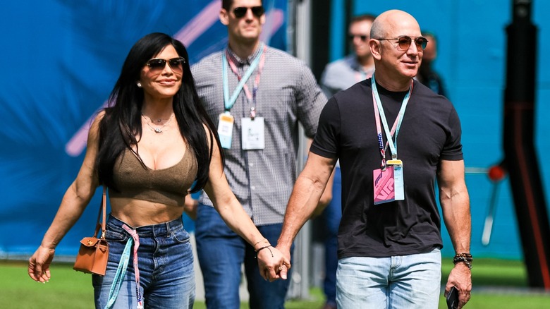Lauren Sánchez and Jeff Bezos holding hands at the Miami Grand Prix in 2023