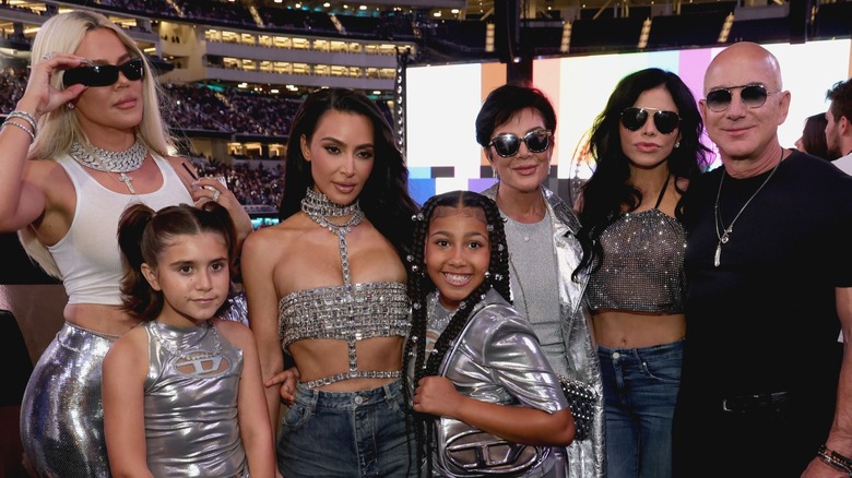 Lauren Sánchez, Jeff Bezos, and members of the Kardashian family posing at a Beyoncé concert in 2023