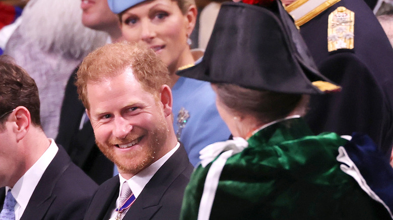 Prince Harry smiles at Princess Anne