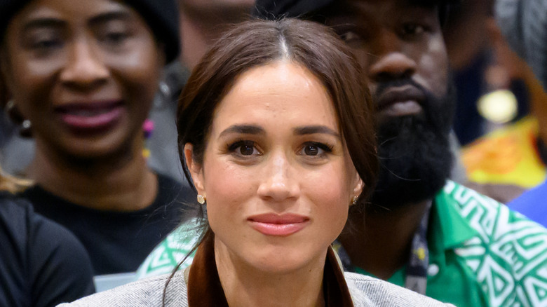 Meghan Markle smiles for a photo