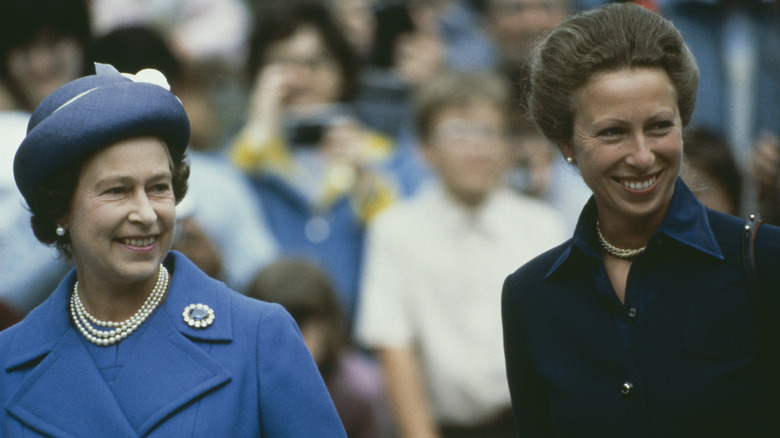 Queen Elizabeth and Princess Anne walking together