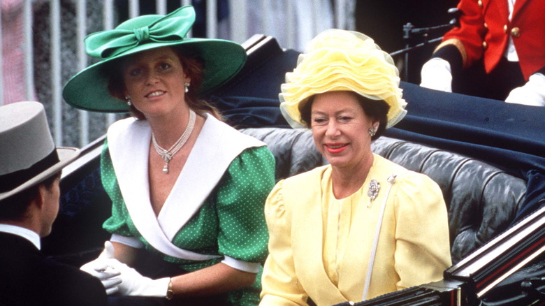 Princess Margaret riding in a carriage with Sarah Ferguson