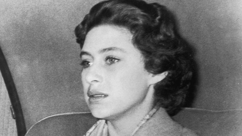 Princess Margaret looking upset in the back of a car