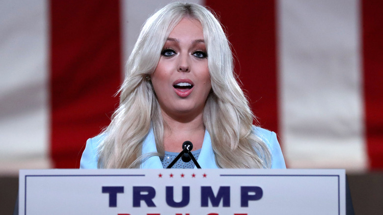 Tiffany Trump wearing a light blue blazer and speaking behind a lectern at the Republican National Convention