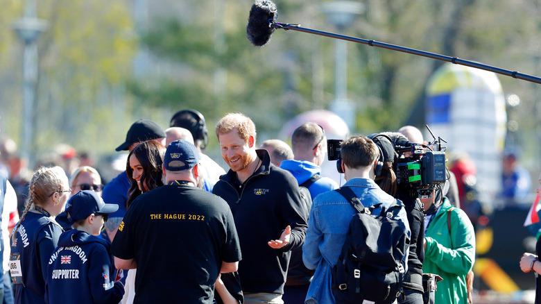 Prince Harry and Meghan Markle being filmed