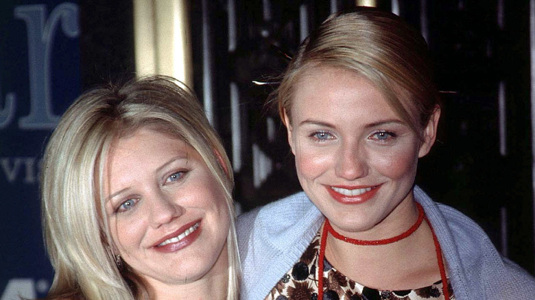 Cameron Diaz (R) and her sister Chimene Diaz smile while posing for photos at the GQ Men of the Year Awards at Radio City Music Hall in New York City on October 21, 1998 (1998)