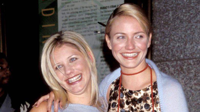 Cameron Diaz (R) and her sister Chimene Diaz smile while posing for photos at the GQ Men of the Year Awards at Radio City Music Hall in New York City on October 21, 1998 (1998)