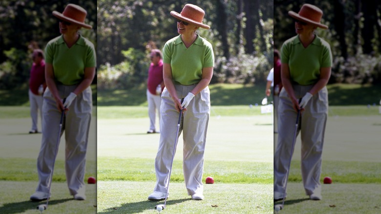 Hillary Clinton playing golf