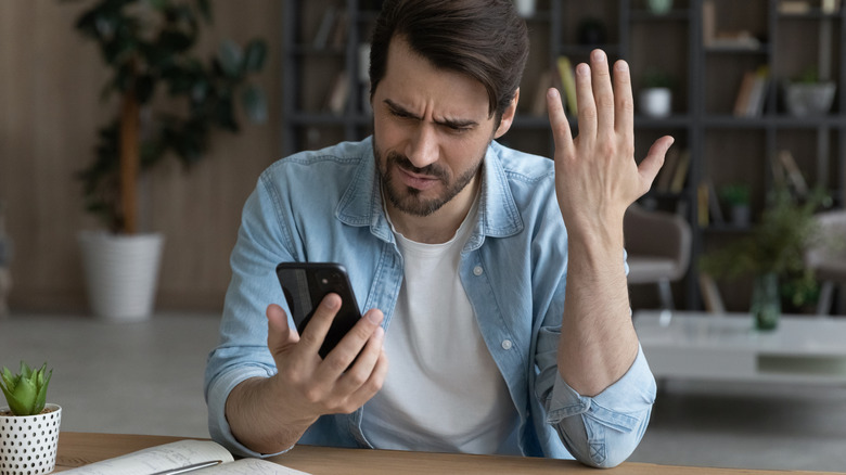 Man frustrated at his phone