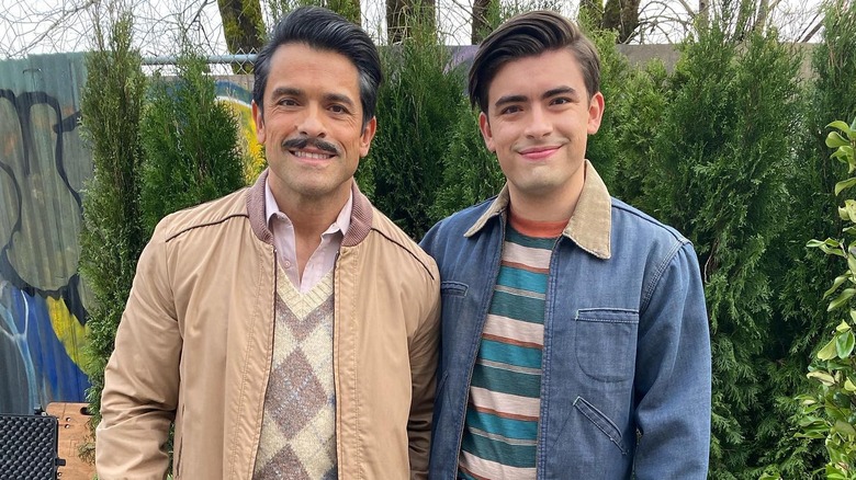 Michael Consuelos standing next to his dad Mark Consuelos dressed as their "Riverdale" characters