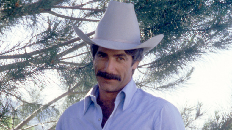 Sam Elliott wearing a cowboy hat on the set of Wild Times