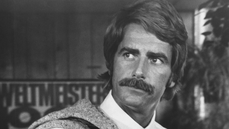 Sam Elliott wearing suit and tie in 1976's Lifeguard