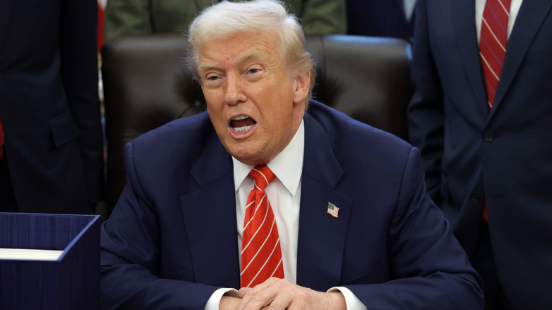 Donald Trump seemingly yelling from behind the Resolute Desk