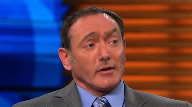 Matthew Barasch on "Dr. Phil" in front of the blue and orange background