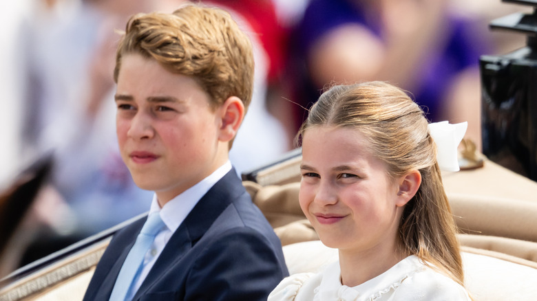 Prince George and Princess Charlotte ride in a car side-by-side
