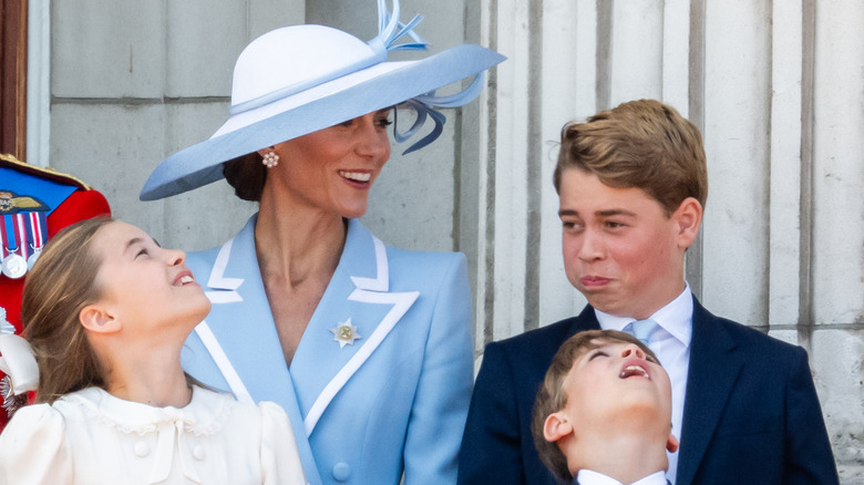 Princess Charlotte, Kate Middleton, Prince George, and Prince Louis pose together on a balcony
