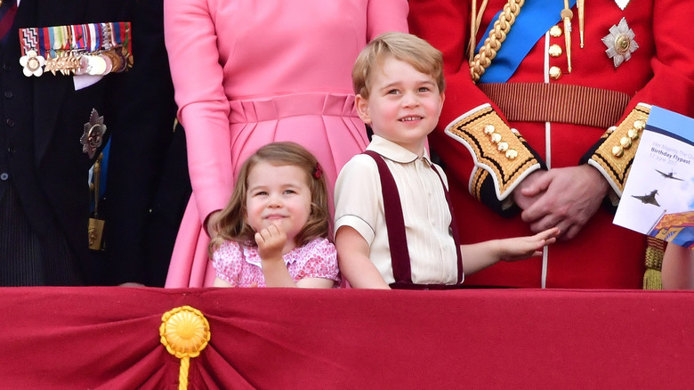 Princess Charlotte and Prince George stand back to back