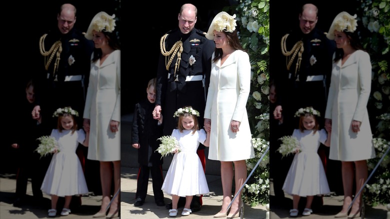 Prince William, Princess Catherine, Prince George, and Princess Charlotte standing outside of St. George's Chapel