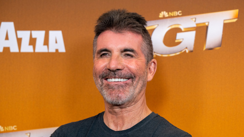 Simon Cowell smiling on the "America's Got Talent" Season 20 Semifinals red carpet.