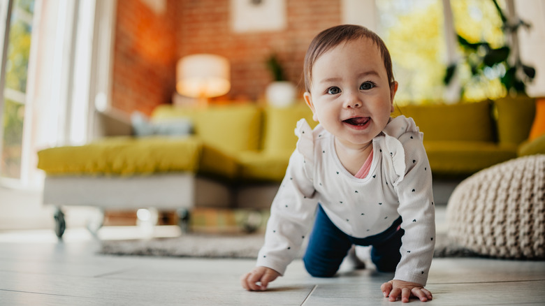 A baby girl crawling