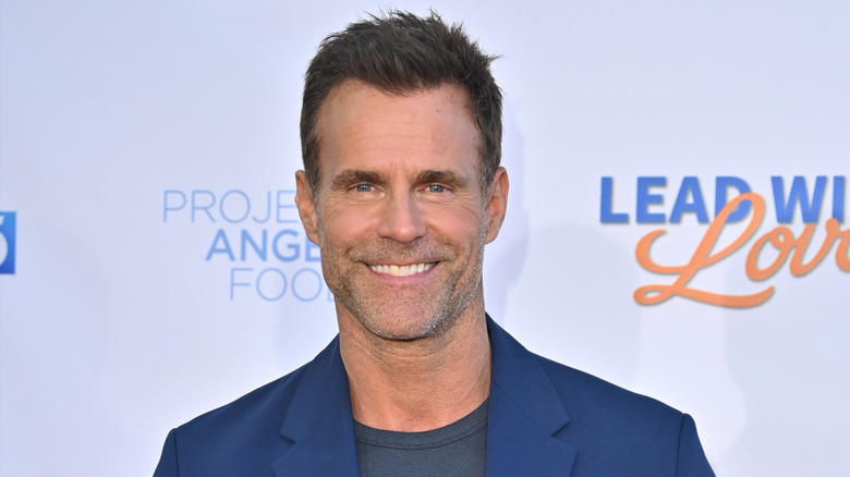 Cameron Mathison posing on the red carpet