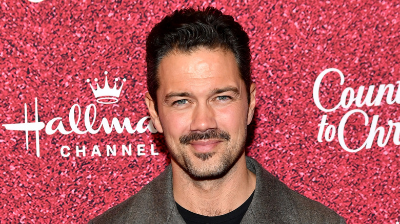 Ryan Paevey posing at a Hallmark event