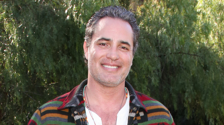 Victor Webster posing outdoors