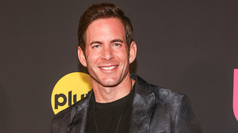 Tarek El Moussa posing at the Us Weekly And Pluto TV Reality Stars Of The Year 2024